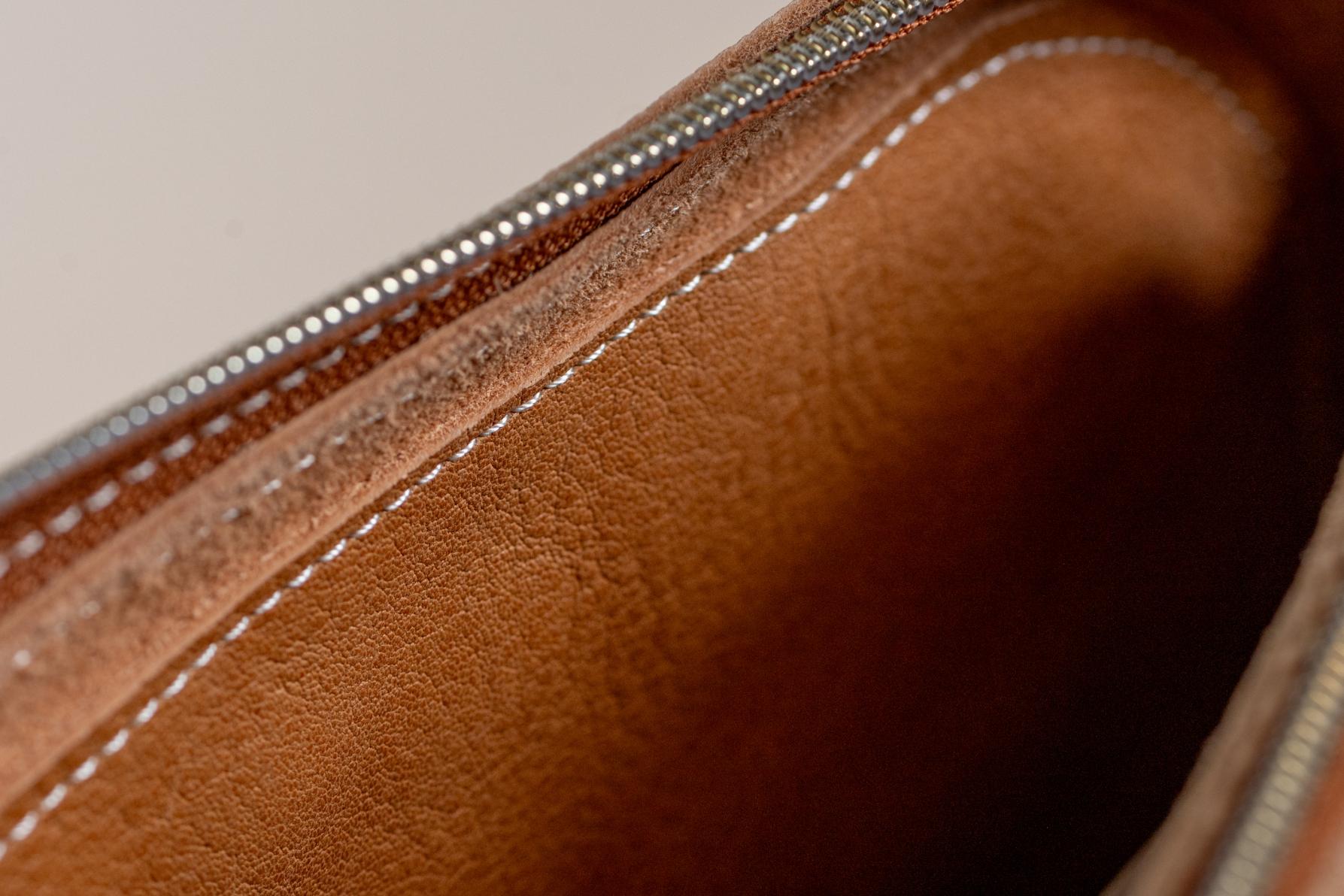 Close-up of Indigo Laine The Laptop Sleeve in Camel, showing the zipper