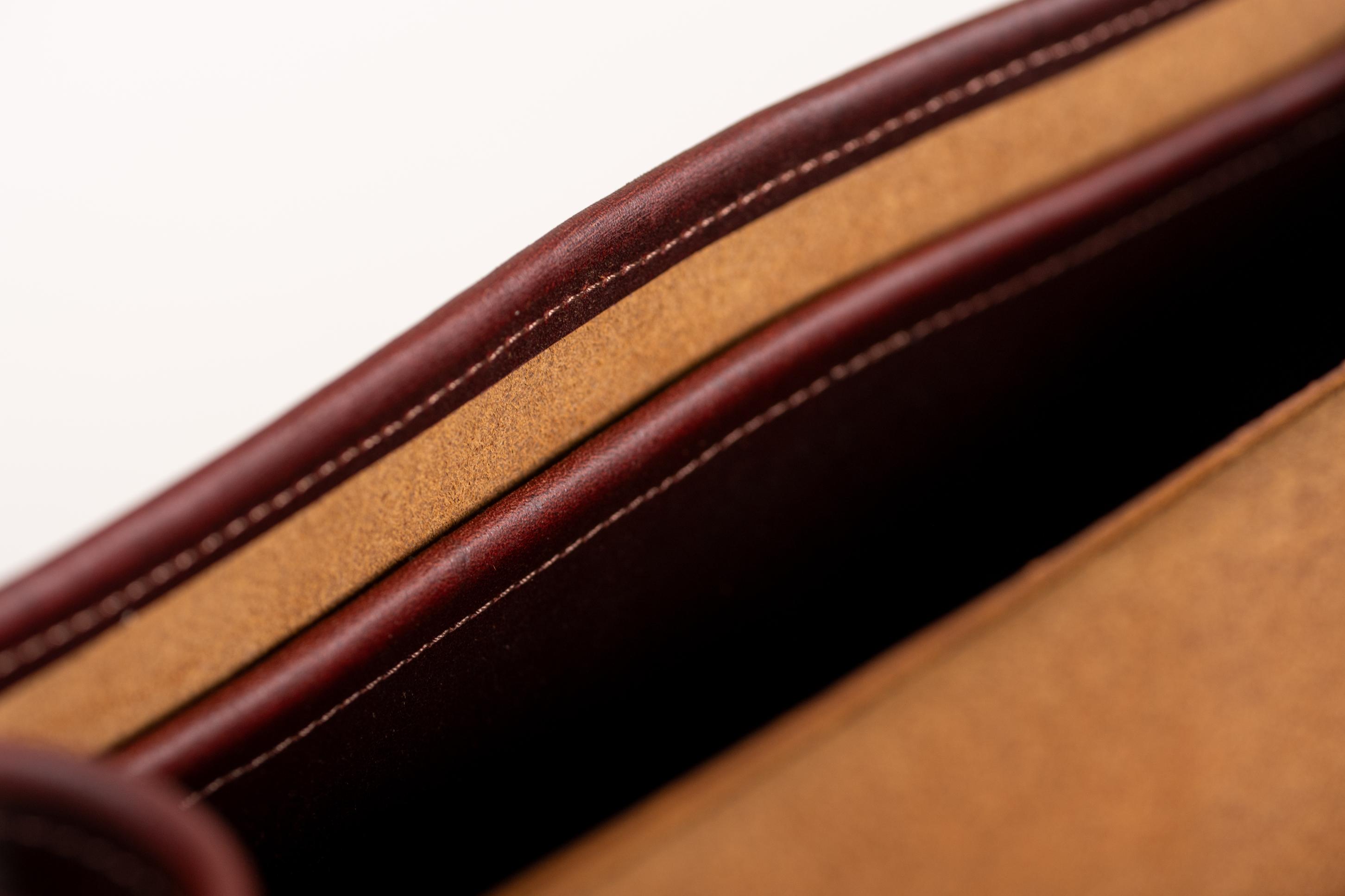 Close-up of Indigo Laine The Satchel in Tobacco, showing stitching