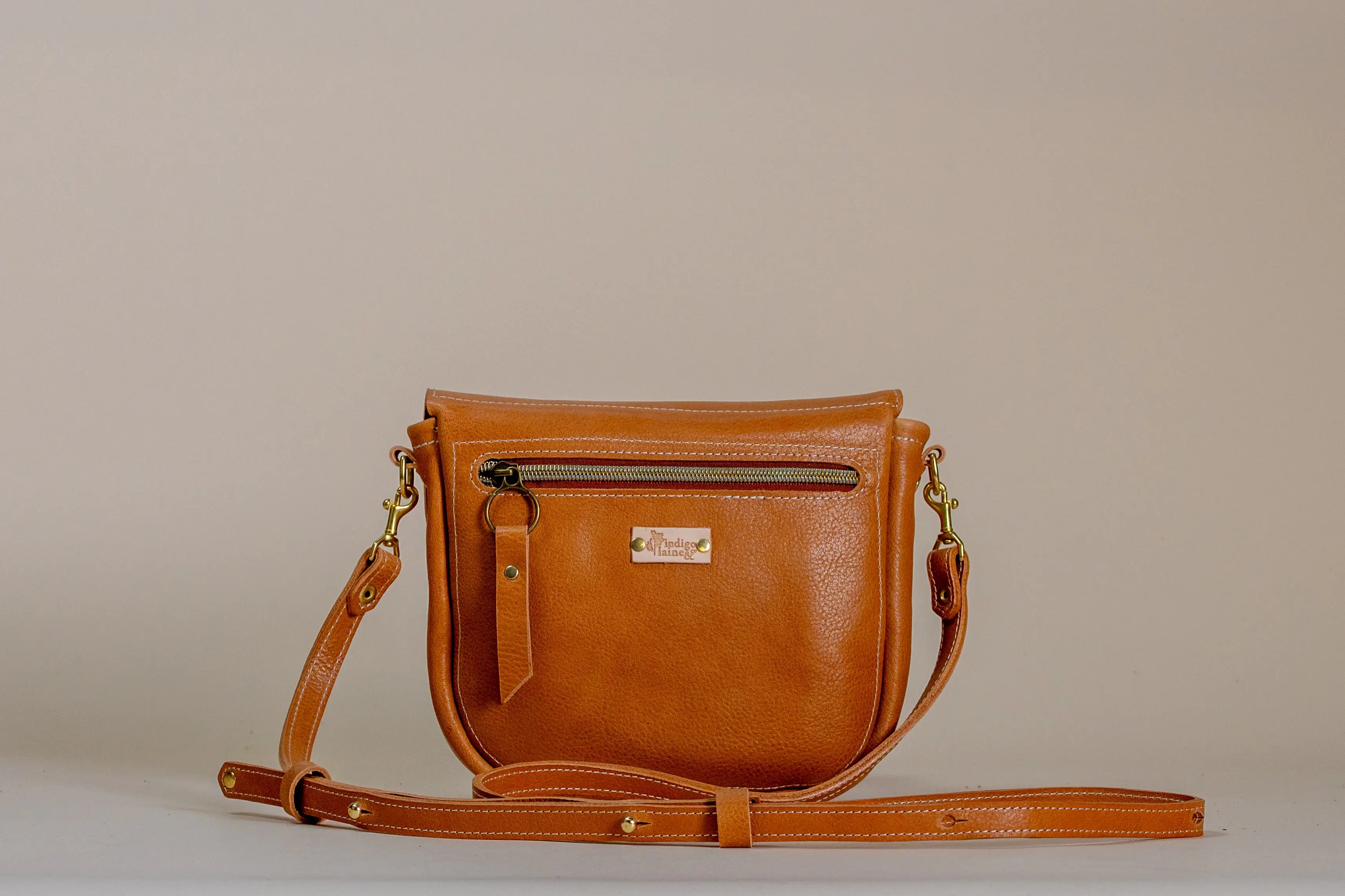 Back view of The Shelly Crossbody in camel with zip pocket