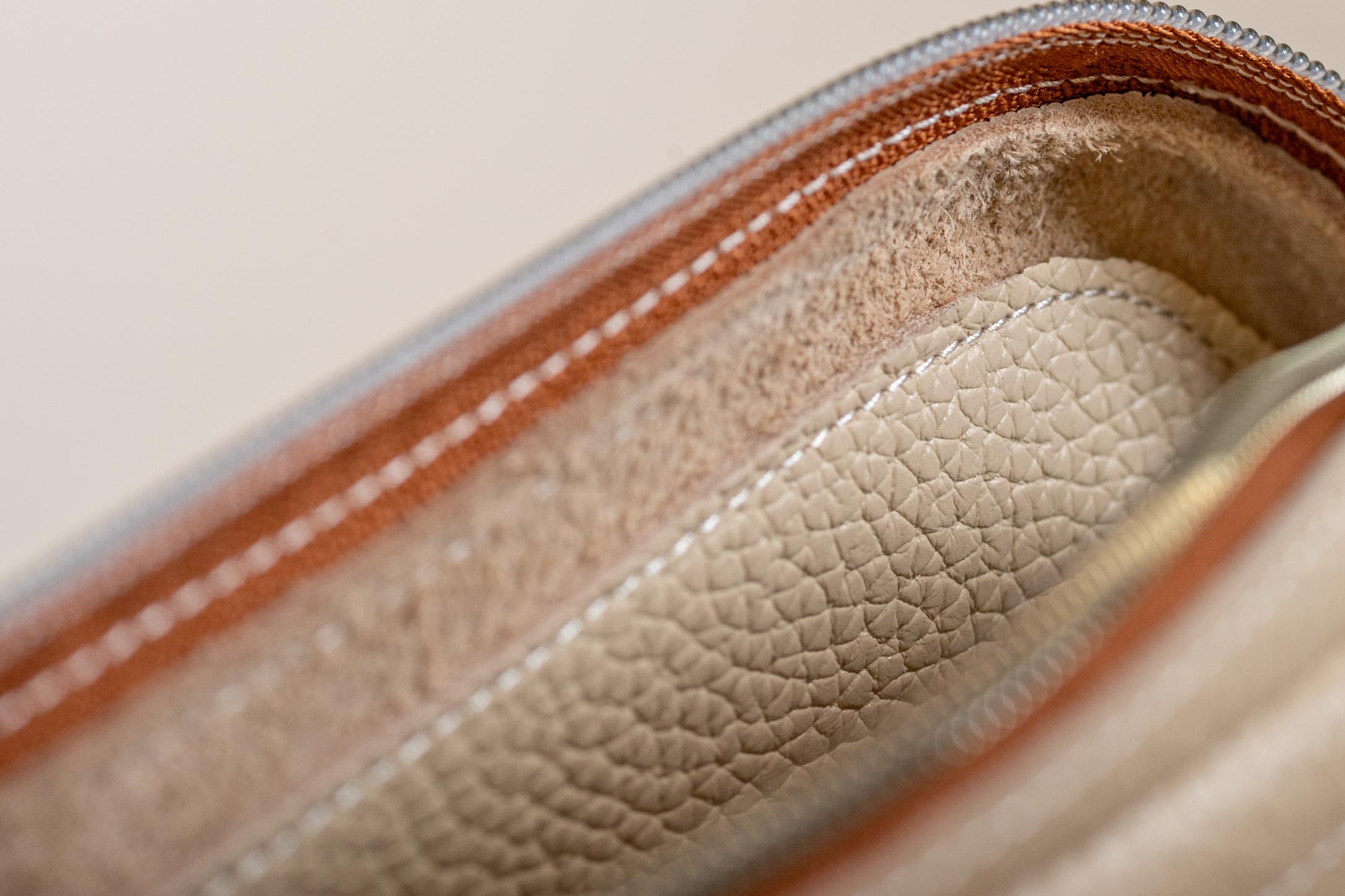 Close-up of Indigo Laine The Laptop Sleeve in Bone, showing texture and stitching details