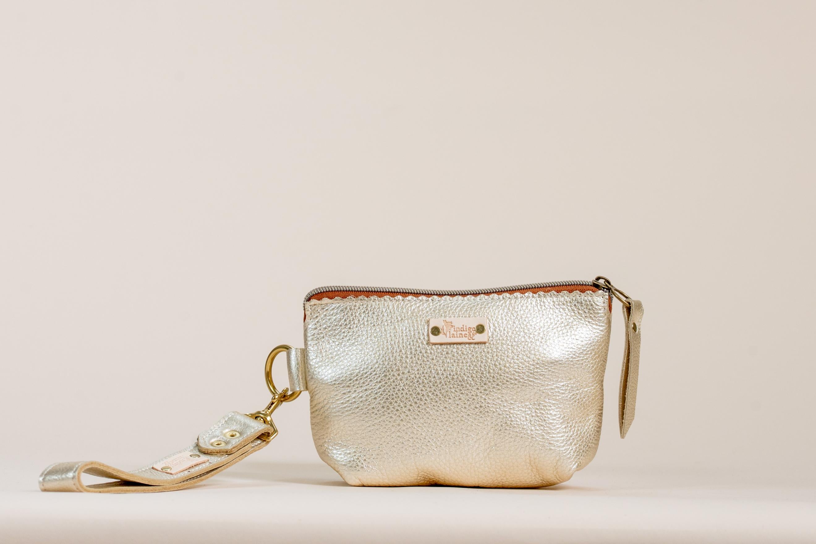 The Sloane wristlet pouch in champagne leather