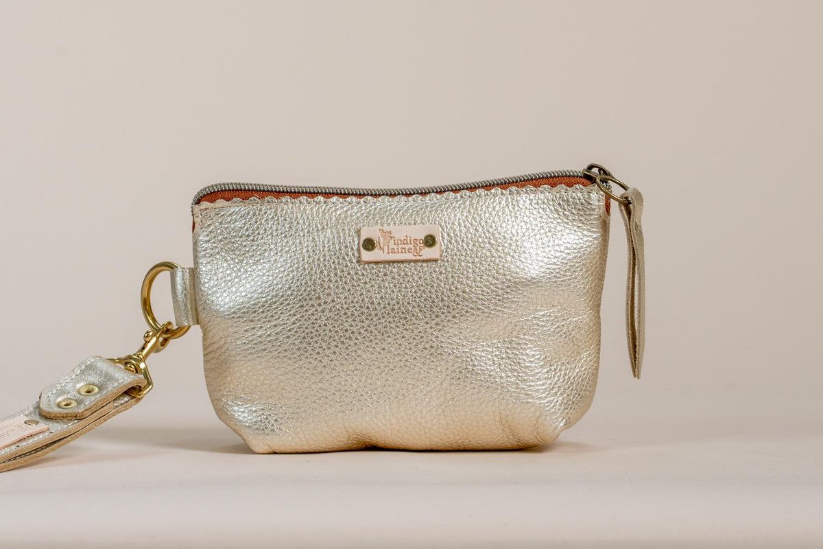 Metallic gold leather zip pouch with wrist strap