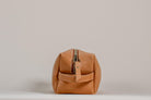 Indigo Laine The Toiletry Kit in Camel, showing the scallop design and zipper