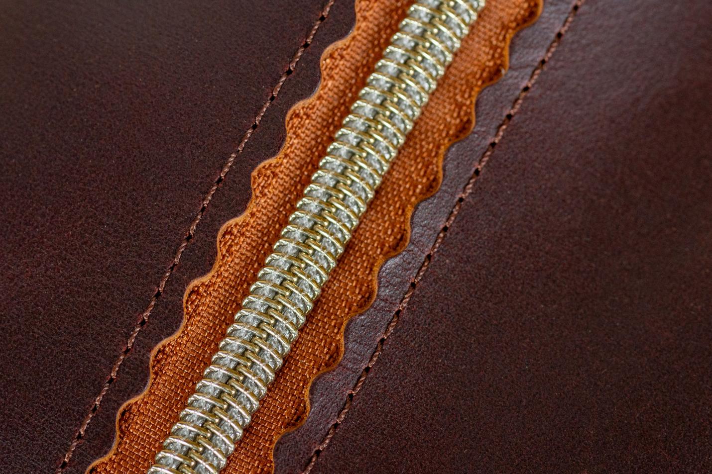 Indigo Laine The Toiletry Kit in Tobacco, showing the scallop design and zipper