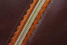 Indigo Laine The Toiletry Kit in Tobacco, showing the scallop design and zipper