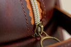 Close-up of Indigo Laine The Toiletry Kit in Tobacco, showing the scallop design and zipper