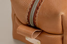 Indigo Laine The Toiletry Kit in Camel, showing the scallop design and zipper