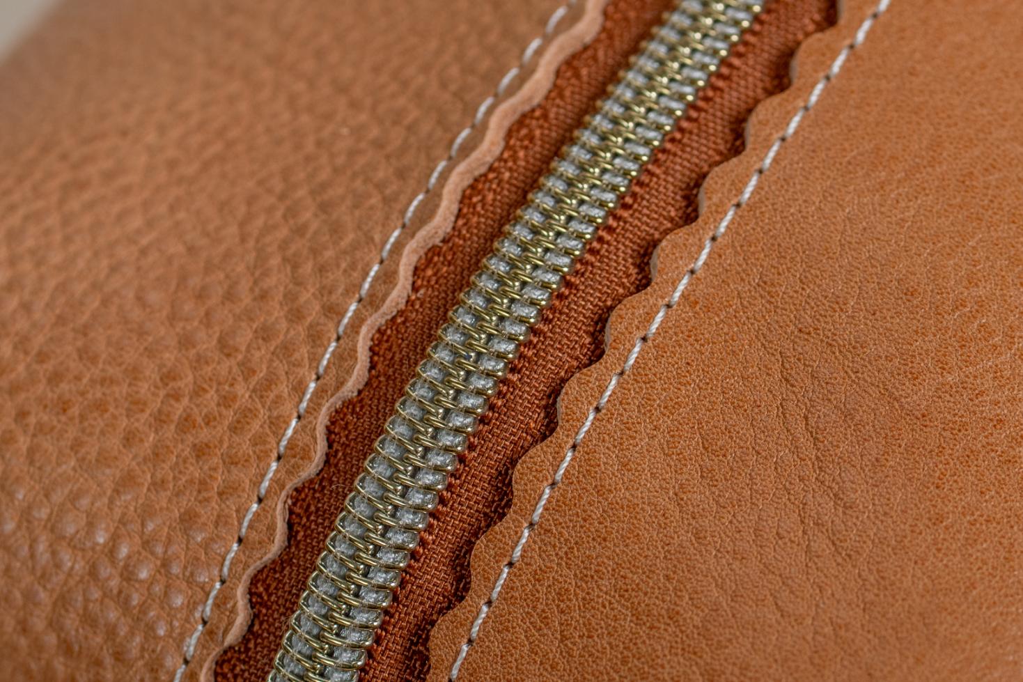 Indigo Laine The Toiletry Kit in Camel, showing the scallop design and zipper