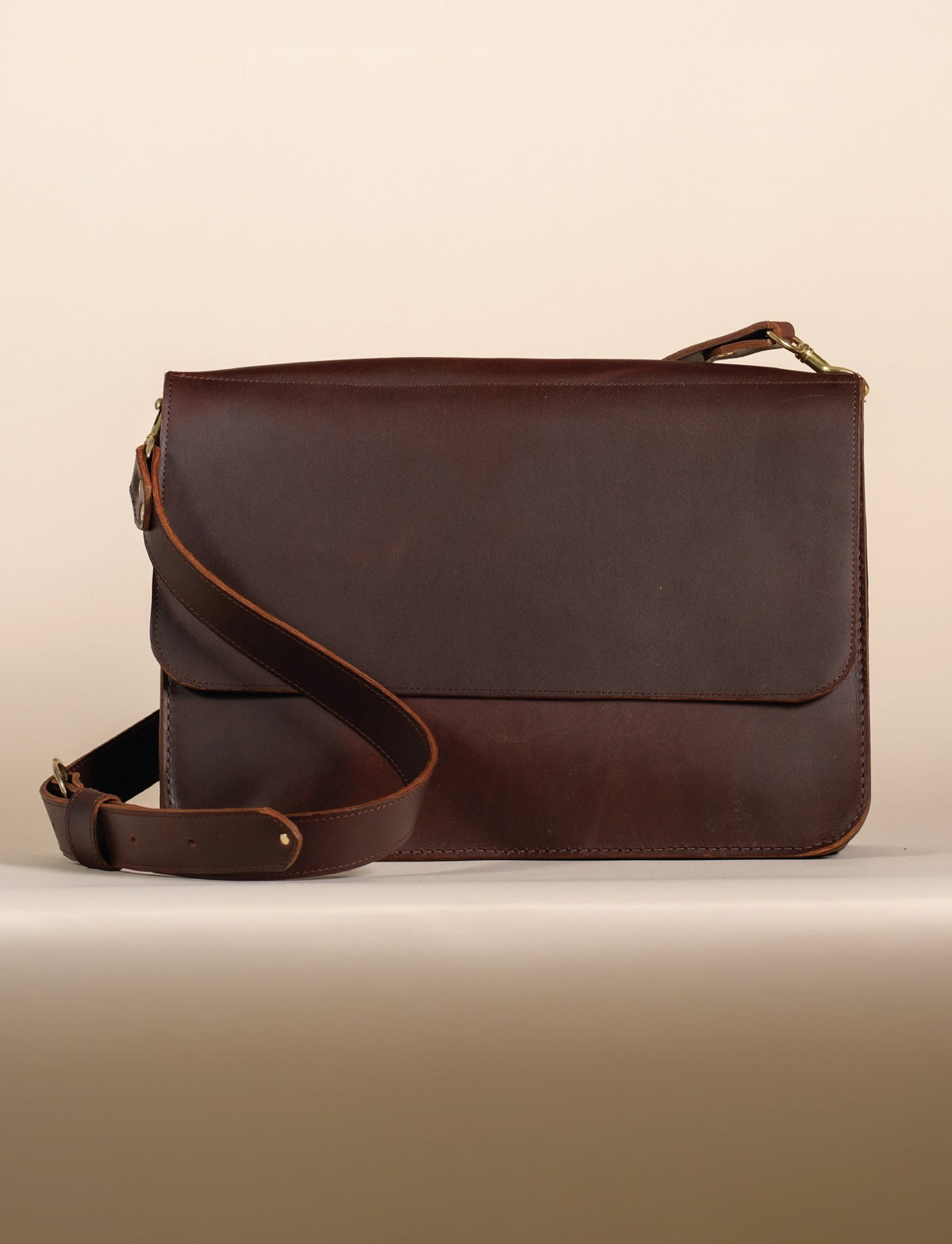 Dark brown leather flap messenger bag