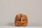 Indigo Laine The Toiletry Kit in Camel, showing the scallop design and zipper