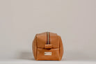 Indigo Laine The Toiletry Kit in Camel, showing the scallop design and zipper